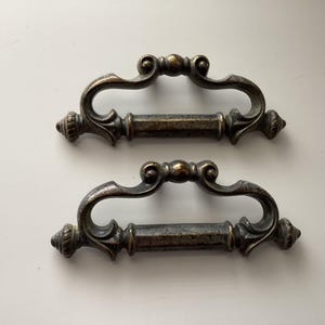 May include: A rustic wooden sign with the text "Welcome to our home" in white lettering. The sign features a distressed finish and a simple, inviting design, perfect for entryway decor.