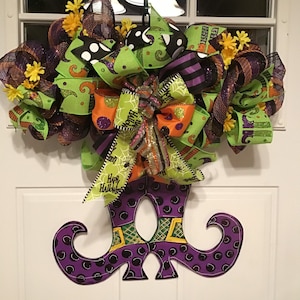 Halloween witch boots wooden rail