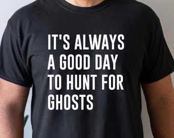 May include: A black t-shirt with white text that reads "It's always a good day to hunt for ghosts."