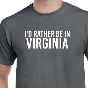 May include: A dark gray t-shirt with white text that reads "I'd rather be in VIRGINIA".
