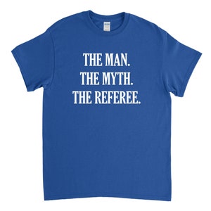 May include: A royal blue t-shirt with white text that reads "The Man. The Myth. The Referee."