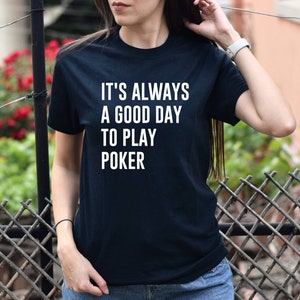 May include: Black t-shirt with white text that reads "It's always a good day to play poker."