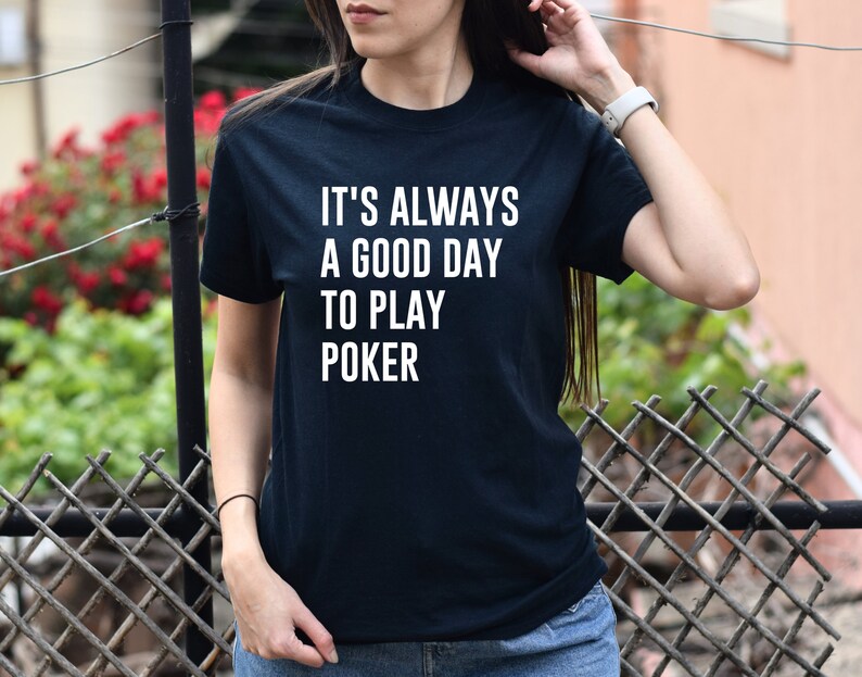 May include: Black t-shirt with white text that reads "It's always a good day to play poker."