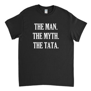 May include: Black t-shirt with white text that reads "The Man. The Myth. The Tata."