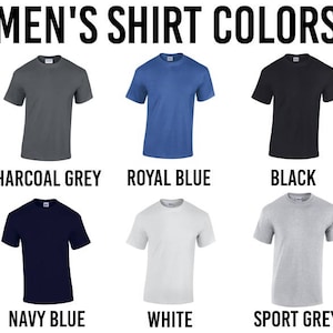 May include: Six different color t-shirts, including charcoal grey, royal blue, black, navy blue, white, and sport grey.