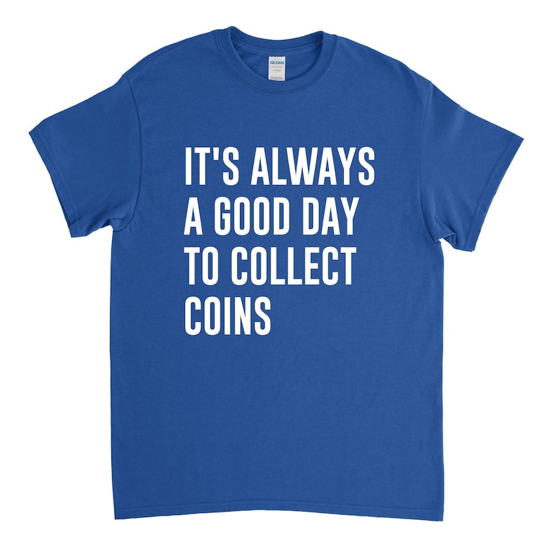 May include: A royal blue t-shirt with white text that reads "It's always a good day to collect coins."