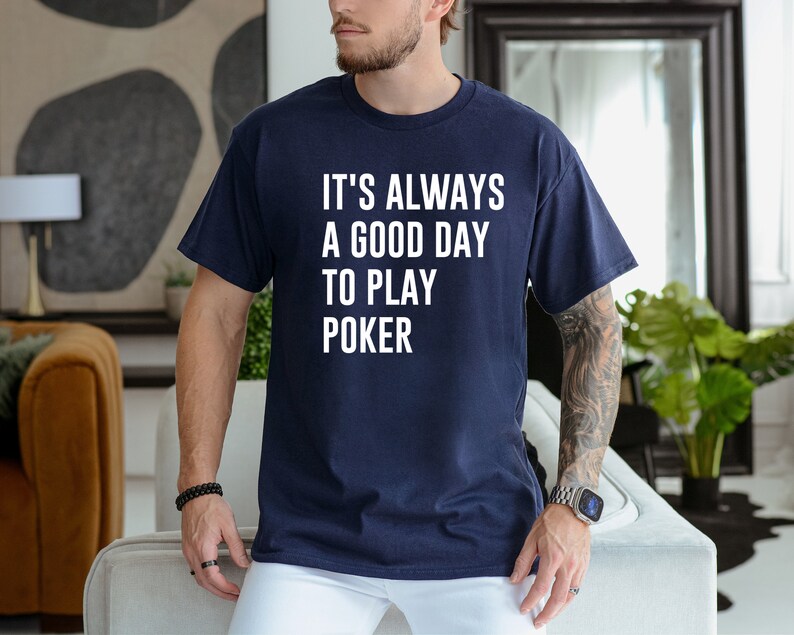 May include: A navy blue t-shirt with white text that reads "It's always a good day to play poker."