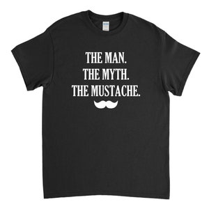 May include: Black t-shirt with white text that reads "The Man. The Myth. The Mustache." and a white mustache graphic.