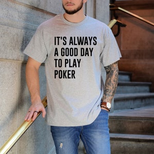 May include: A gray t-shirt with the text "It's always a good day to play poker" printed on the front.