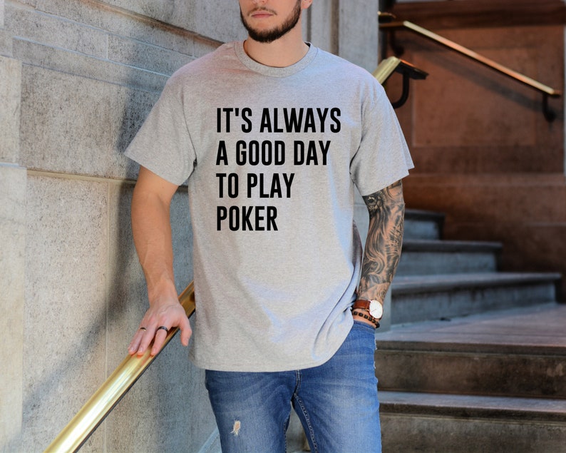 May include: A gray t-shirt with the text "It's always a good day to play poker" printed on the front.