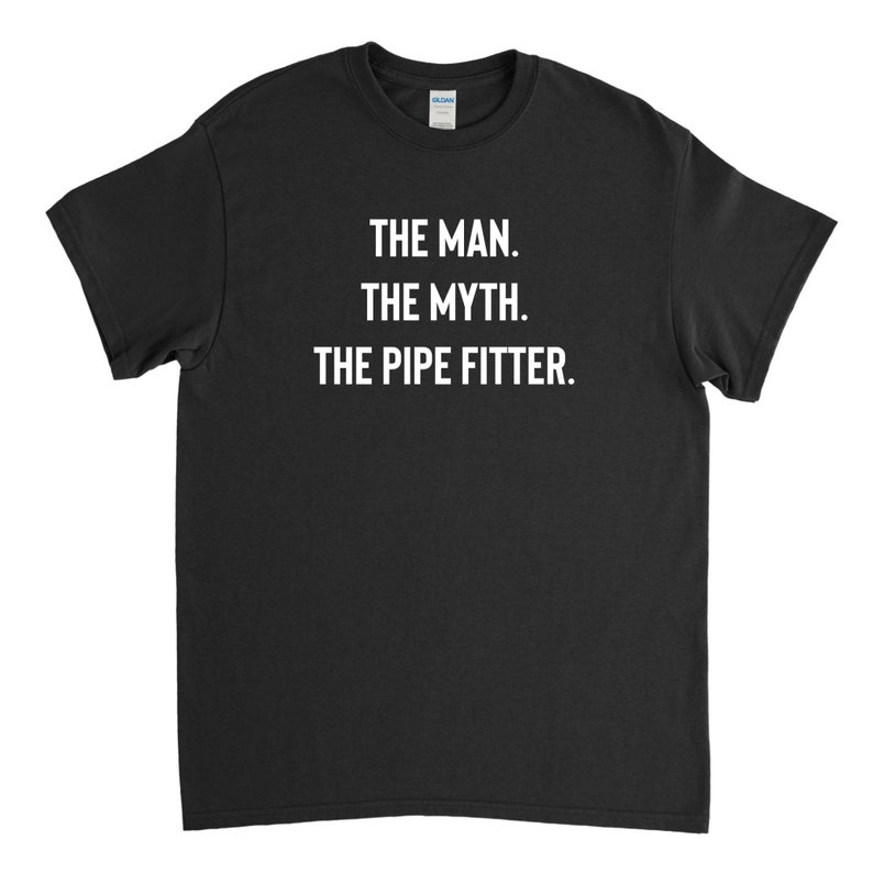 May include: Black t-shirt with white text that reads "The Man. The Myth. The Pipe Fitter."