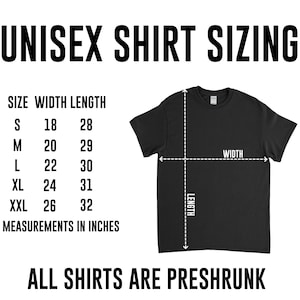 May include: Unisex t-shirt sizing chart with measurements in inches. The chart shows the width and length of the shirt in inches for sizes S, M, L, XL, and XXL. The text "ALL SHIRTS ARE PRESHRUNK" is at the bottom of the chart.