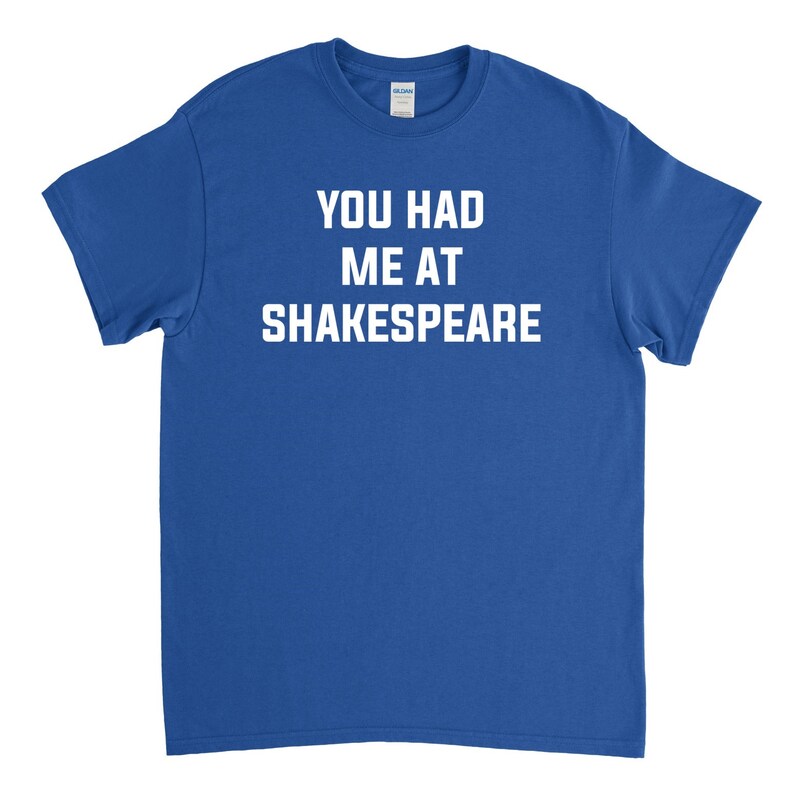 May include: A royal blue t-shirt with white text that reads "You had me at Shakespeare."