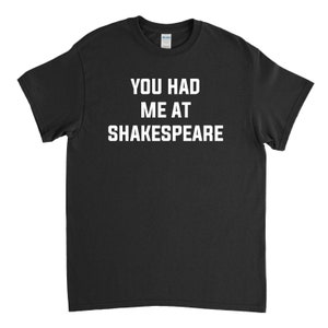 May include: Black t-shirt with white text that reads "You had me at Shakespeare."