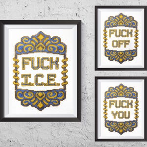 May include: Three framed cross-stitch artworks with black frames. The artworks feature gold and blue decorative borders with text in the center. The text in the artworks reads "FUCK ICE", "FUCK OFF", and "FUCK YOU".
