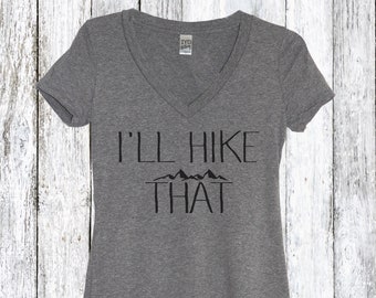 May include: Gray V-neck t-shirt with the text "I'll Hike That" and a graphic of mountains.