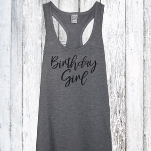 May include: Gray tank top with the text "Birthday Girl" in black script.
