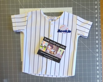 Boys Baseball Jersey  "ROOKIE " Logo  & Numer included      Does -- NOT--- include name     ASK B4 You Buy specific date or Customization