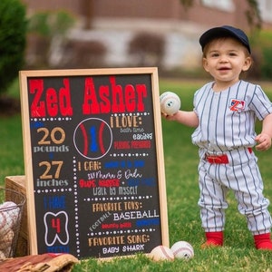May include: A chalkboard sign with the text "Zed Asher" and details about a baby's milestones, including weight, height, and favorite activities. The sign is decorated with a baseball graphic and a baseball is held by a baby wearing a baseball uniform.