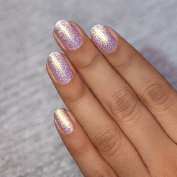 Hi all! I'm looking for a warm, gold glittery sheer nail polish. Any ideas?  (Inspo images - not my own!) : r/lacqueristas