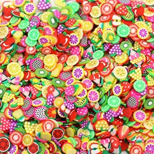 May include: Assortment of colorful fruit-shaped polymer clay charms, including lemons, strawberries, kiwi, and watermelon. These charms are perfect for adding a touch of whimsy to jewelry, crafts, and other projects.