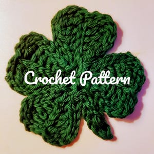 May include: A green crocheted shamrock, a traditional Irish symbol, with the text "Crochet Pattern" in white.