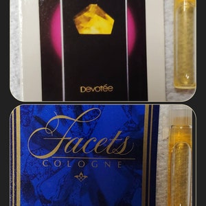 May include: Two small perfume bottles with gold caps. The bottles are filled with a clear liquid. The bottles are on a white background. The bottle on the left is labeled "Facets Cologne". The bottle on the right is labeled "Devotee".