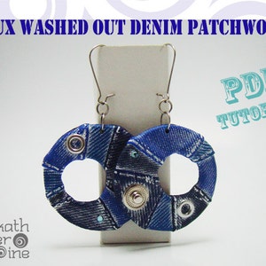 May include: A pair of blue denim patchwork earrings with silver metal accents and a PDF tutorial. The earrings are hanging from a white display stand.
