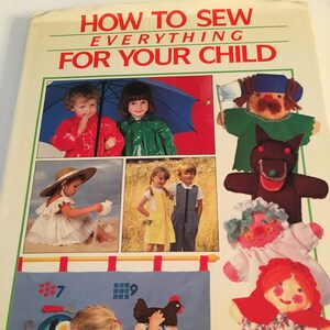 May include: A book cover titled "HOW TO SEW EVERYTHING FOR YOUR CHILD" with images of children and handmade toys. The cover features a girl interacting with a felt board and various sewn dolls.