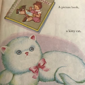 May include: Illustration from a children's book featuring a white fluffy cat with a pink bow and a book titled "Baby's Mother Goose." The book cover shows a child reading. The background is a soft pink.
