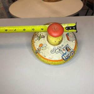 Vintage metal top 1950s circus print toy top Ohio art spinning top