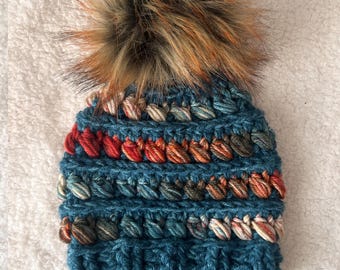 Children's Winter Hat (2-10 years) (18-20 inch). This is super soft, perfect for winter time. Vibrant colors. Pom is removable for washing.