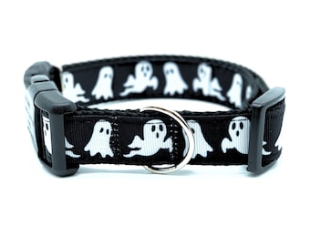 May include: Black dog collar with a white ghost pattern.