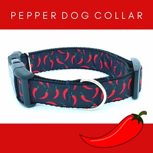 May include: A black dog collar with a red chili pepper pattern. The collar has a black buckle and a silver D-ring. The text "PEPPER DOG COLLAR" is displayed above the collar.