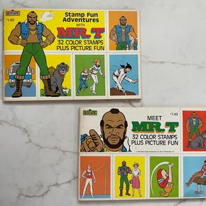 May include: Two vintage stamp sets featuring illustrations of Mr. T. The top set is titled "Stamp Fun Adventures with Mr. T" and the bottom set is titled "Meet Mr. T." Each set contains 32 color stamps and picture fun.