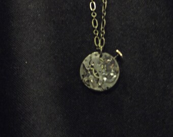 Steampunk style brass chain necklace with watch movement pendant