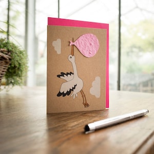 Carte de naissance "La Cigogne" | Carte de voeux avec sachet de graines en papier à planter | Contient 10 graines de fleurs sauvages différentes
