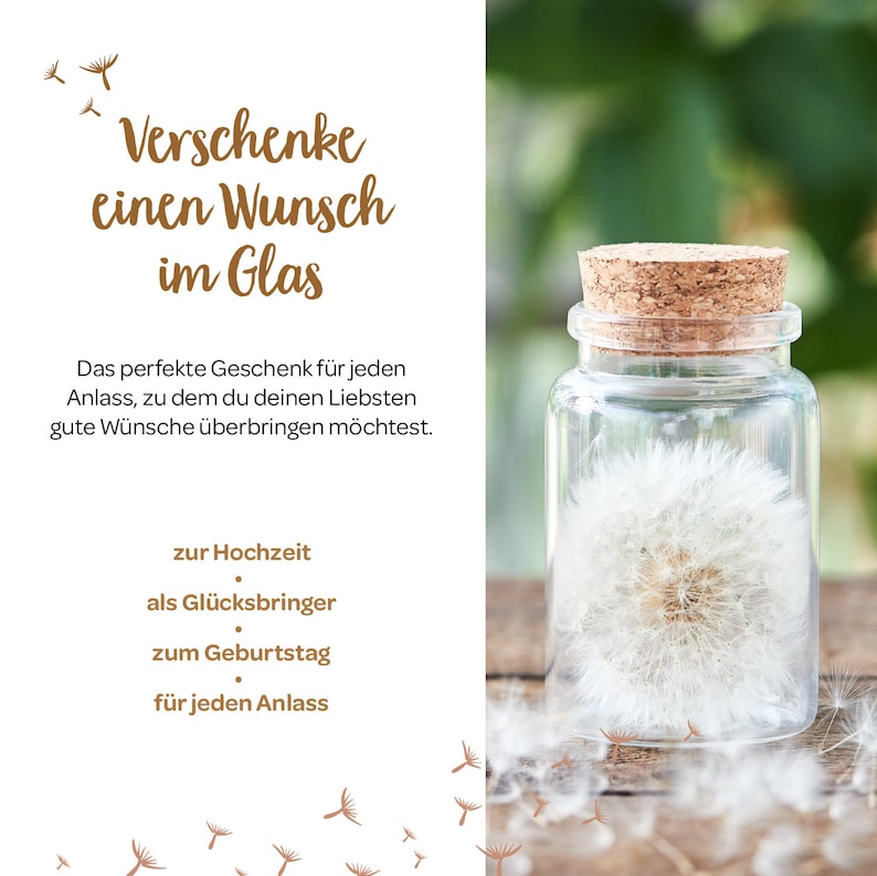 May include: A glass jar with a cork lid containing a white dandelion. The jar is sitting on a wooden surface. The text "Verschenke einen Wunsch im Glas" is written in brown lettering on a white background. The text below reads "Das perfekte Geschenk f&uuml;r jeden Anlass, zu dem du deinen Liebsten gute W&uuml;nsche &uuml;berbringen m&ouml;chtest." and "zur Hochzeit, als Gl&uuml;cksbringer, zum Geburtstag, f&uuml;r jeden Anlass."