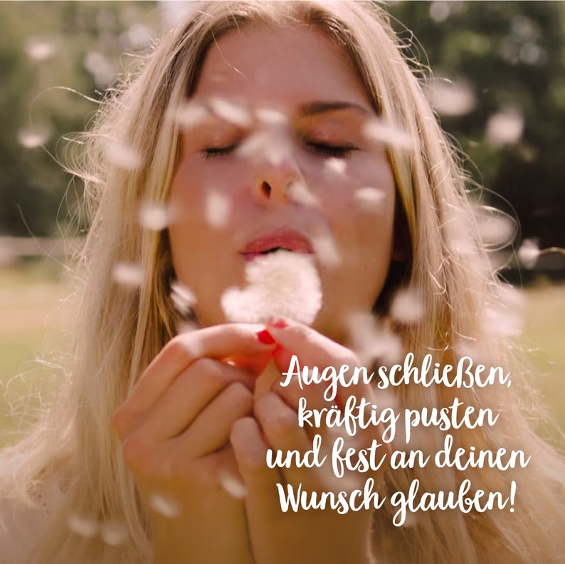 May include: A woman with blonde hair blows on a dandelion with her eyes closed. The text on the image reads: "Augen schlie&szlig;en, kr&auml;ftig pusten und fest an deinen Wunsch glauben!"
