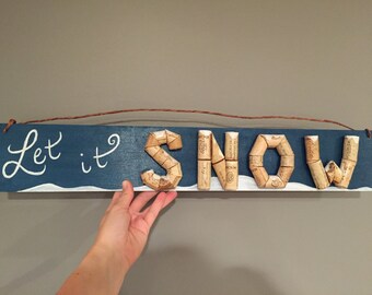 Sign made from recycled wine corks - "Let it SNOW"