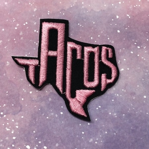 May include: Pink embroidered patch shaped like the state of Texas with the word "ACOS" inside.