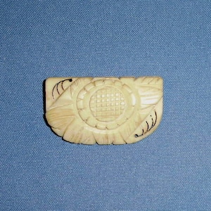 1920's Carved Pierced Cream Bakelite Brooch