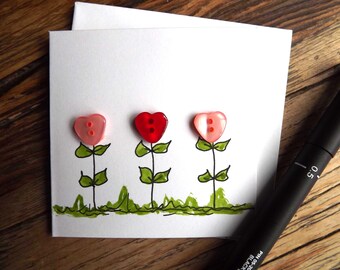 Pretty heart flower  card- handmade with watercolour and pretty pastel coloured heart buttons.  3 x 3 inches with envelope.