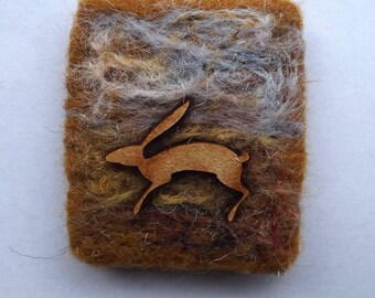 Moorland inspired brooch with leaping hare . Pennine landscape brooch. Mini Hand felted pin.
