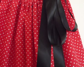 Adult Minnie Mouse inspired Self Tie Skirt, bright red with white polka dots and a black satin ribbon.