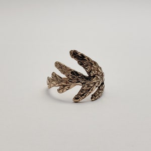 Cedar branch ring in bronze image 1