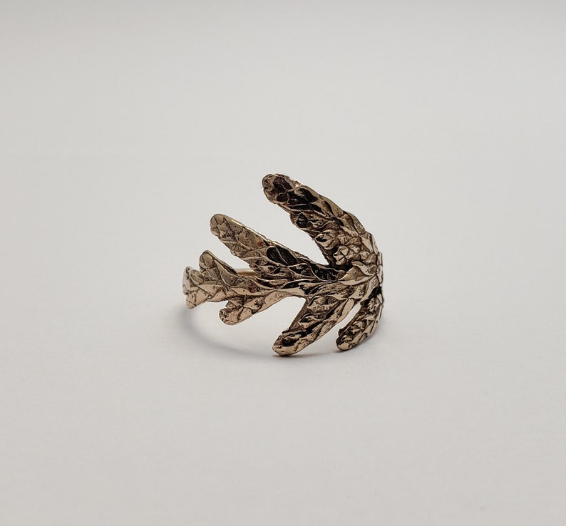 Cedar branch ring in bronze image 1