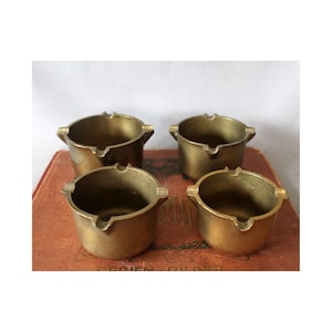 May include: A set of three ceramic mugs with a speckled, matte finish in cream, light grey, and dark grey. Each mug has a simple, minimalist design, ideal for coffee or tea.