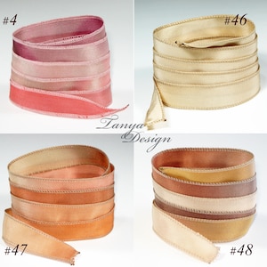 May include: Four spools of ribbon with different color combinations. The ribbons are all satin and have a subtle ombre effect. The colors are pink, peach, beige, and brown. The spools are labeled with numbers 4, 46, 47, and 48.