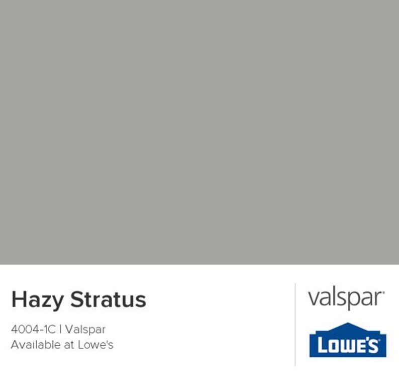 May include: Hazy Stratus paint color swatch, a light gray color, with the text "Hazy Stratus", "4004-1C | Valspar", and "Available at Lowe's". The Valspar logo is in the bottom right corner, with the Lowe's logo below it.